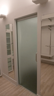 Glass door to ensuite bathroom
